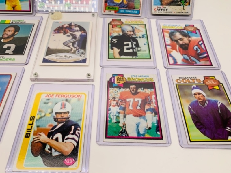 Photo 2 of 12 older sports cards in hard plastic sleeves 