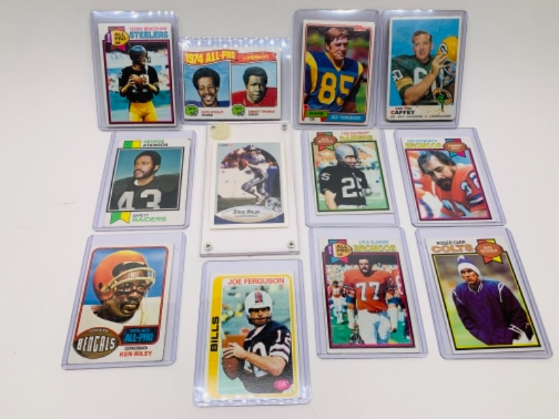 Photo 1 of 12 older sports cards in hard plastic sleeves 