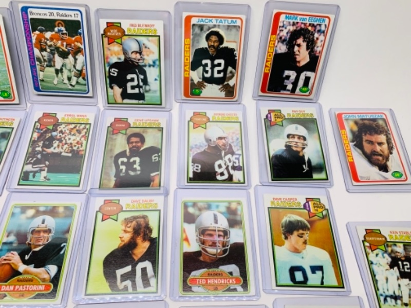 Photo 2 of 26 vintage raiders football trading cards in hard plastic sleeves