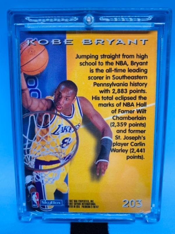Photo 1 of 1997 skybox Kobe Bryant rookie card 203 in hard plastic case 