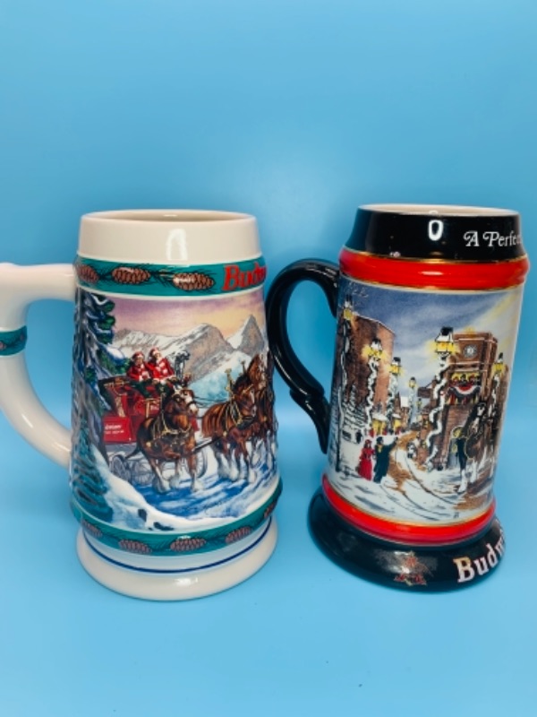 Photo 1 of Two 7 inch vintage Budweiser Christmas Steins