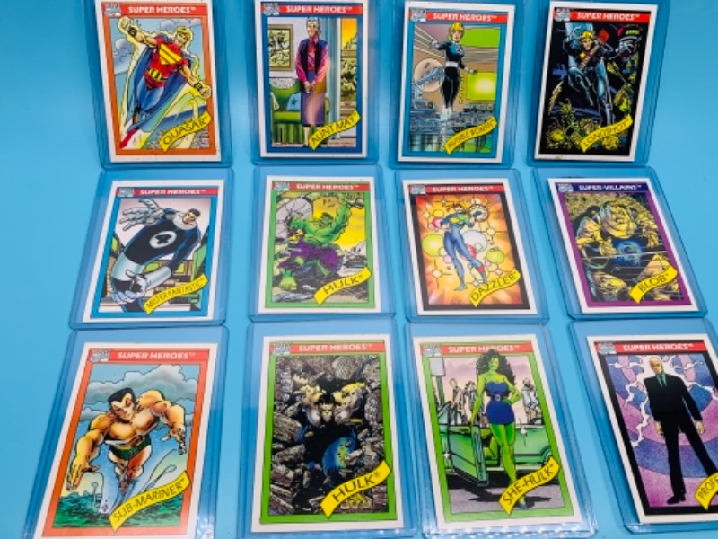 Photo 1 of 12 vintage 1990 Marvel super heroes  and super villains cards in plastic sleeves