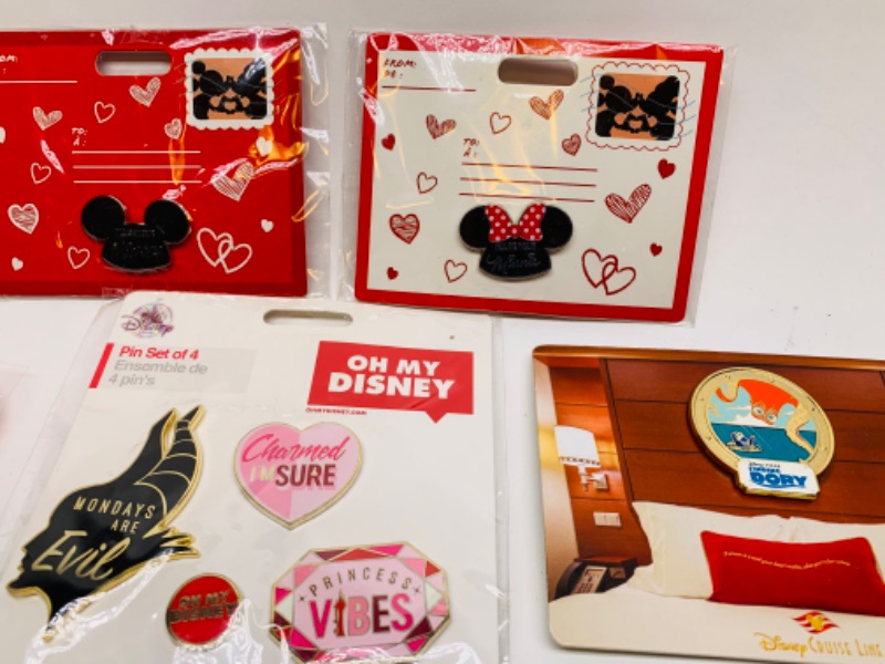 Photo 2 of 5 Disney pin sets in packages 