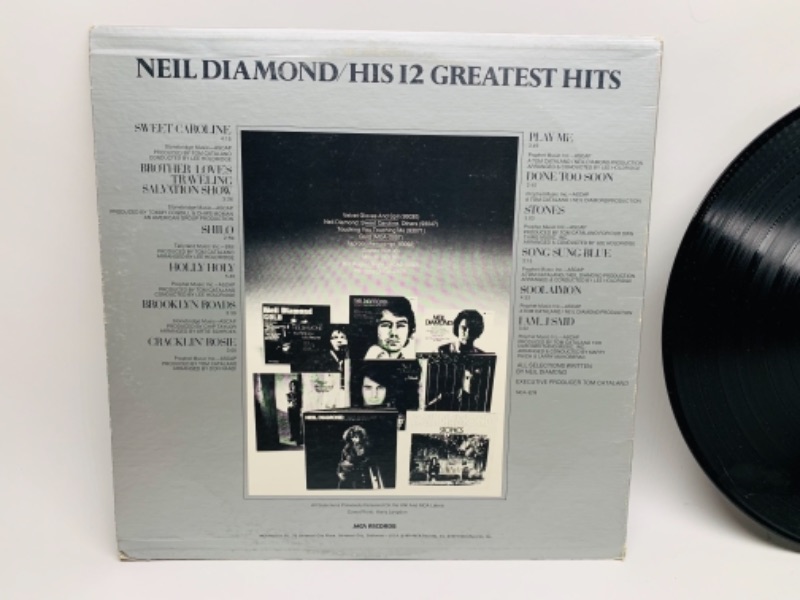 Photo 2 of 1974 Neil diamond greatest hits vinyl 33 rpm record in plastic sleeve cover and record in great condition for age 