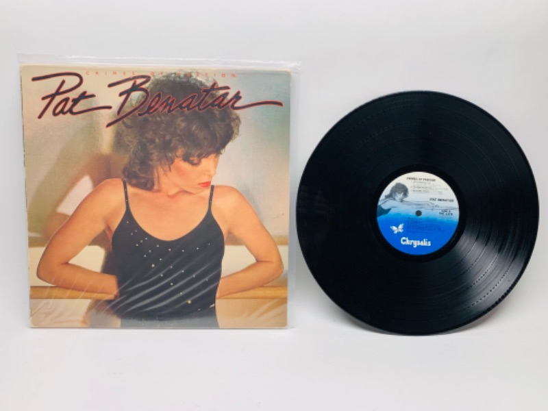 Photo 1 of 1980 pat Benatar crimes of passion Vinyl 33 rpm record in plastic sleeve cover and record in great condition for age 