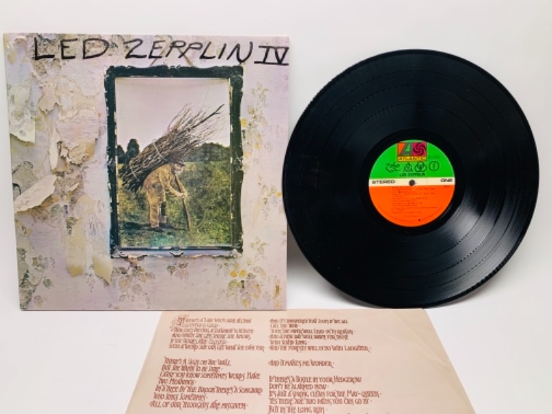 Photo 1 of Led Zeppelin IV vinyl 33 rpm record in plastic sleeve cover and record in great condition for age 