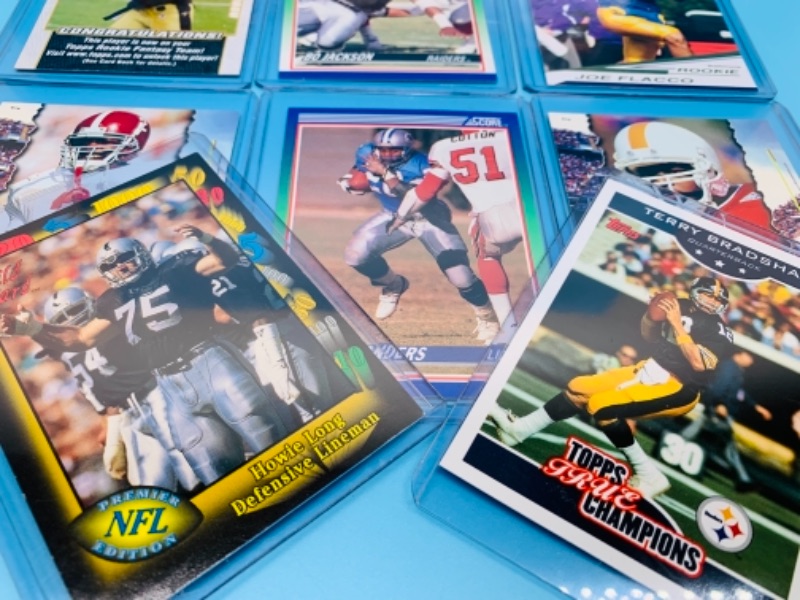 Photo 2 of 11 football trading cards in hard plastic sleeves 