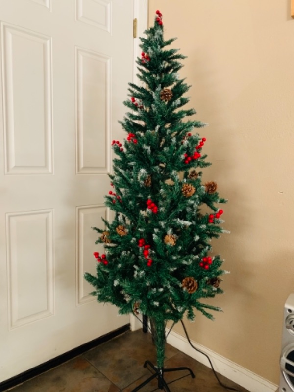 Photo 1 of 766358…Approximately 6 foot Christmas tree with stand in box 