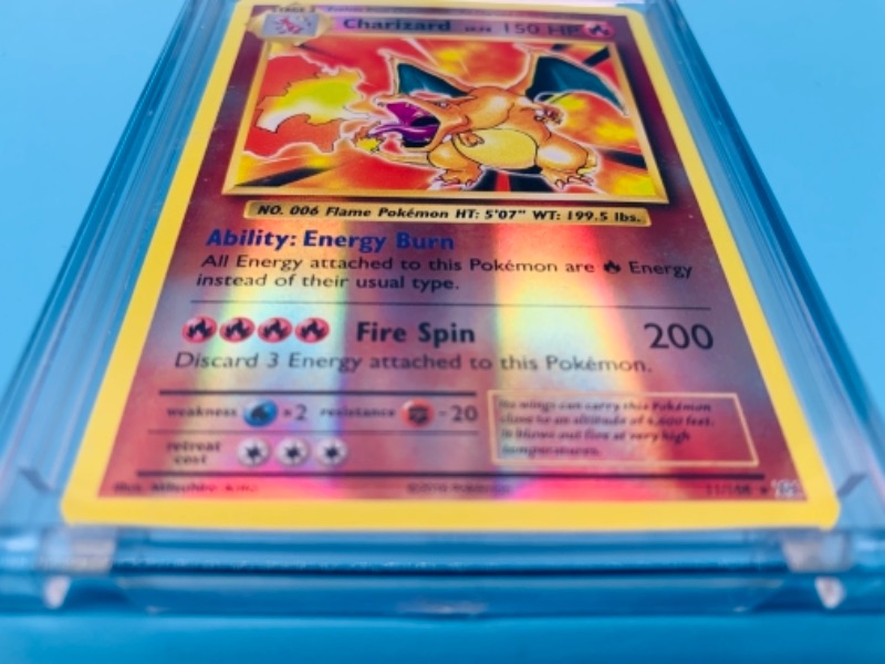Photo 6 of 766532…highly collectible Pokémon charizard 11/108 card in hard plastic case 