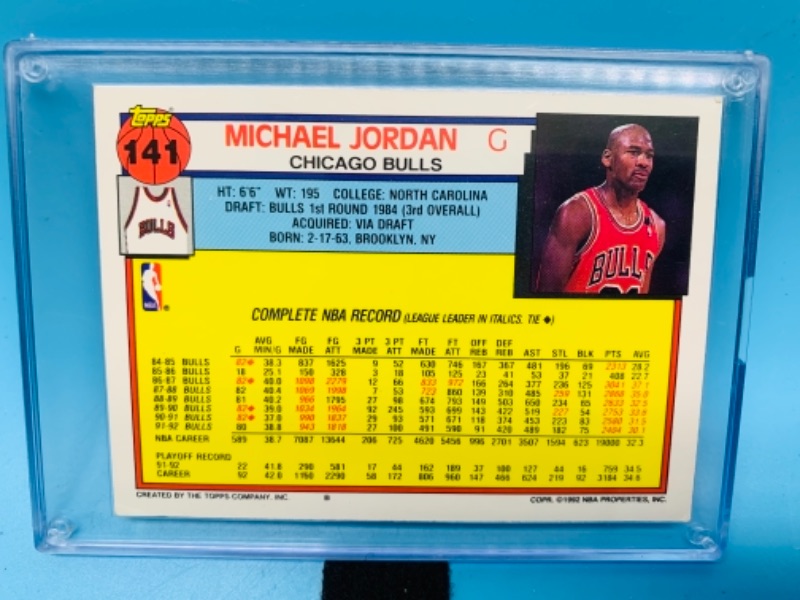 Photo 2 of 766823…topps 1992 Michael Jordan card 141 in  hard plastic case