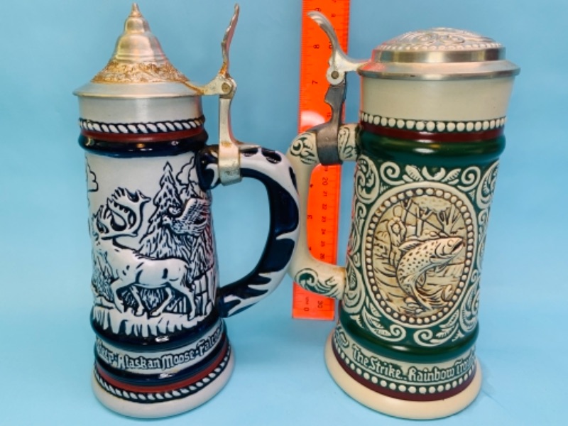 Photo 1 of 766873…two 9 inch animal steins handcrafted in Brazil 