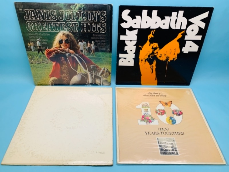 Photo 1 of 766888…four vinyl records all have record and cover damage issues. Beatles white album, Black Sabbath, Janis Joplin, 