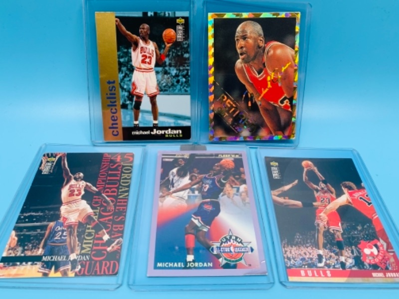 Photo 1 of 767019…5 Michael Jordan cards- all have minor bends, creases, or corner damage 