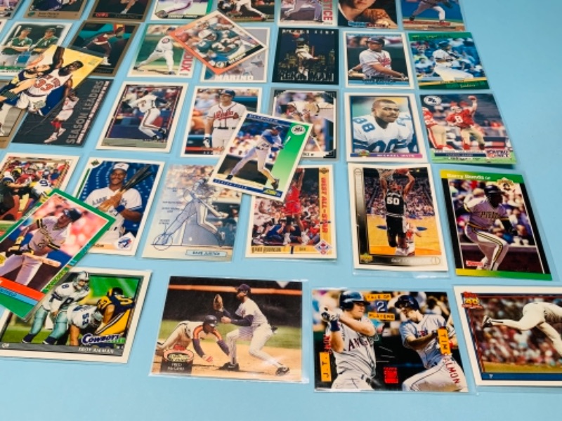 Photo 2 of 767228…75 mixed sports cards in plastic sleeves 