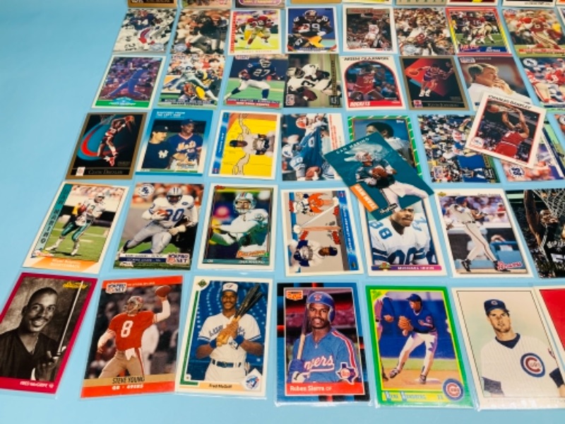 Photo 2 of 767231…75 mixed sports cards in plastic sleeves 