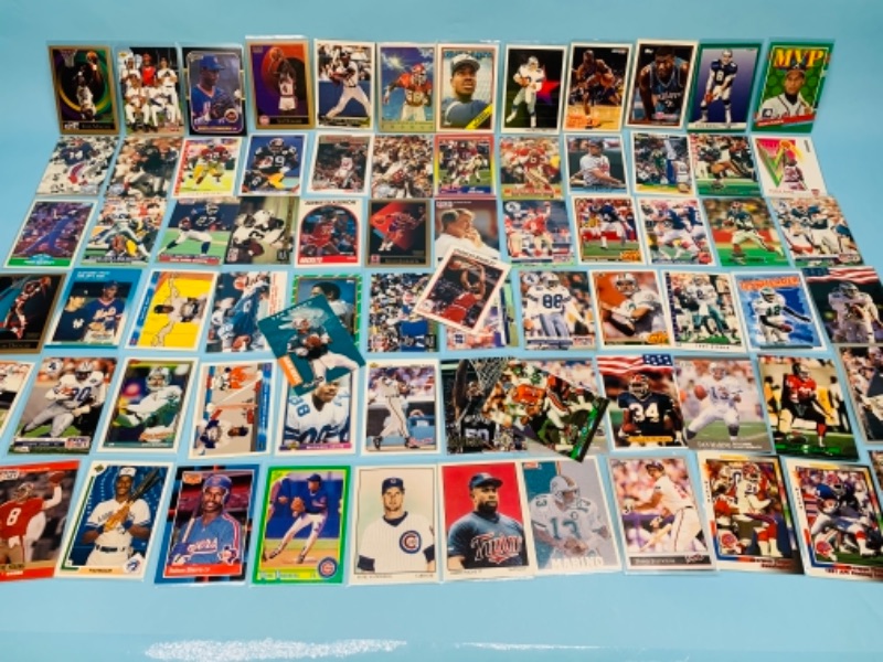 Photo 1 of 767231…75 mixed sports cards in plastic sleeves 