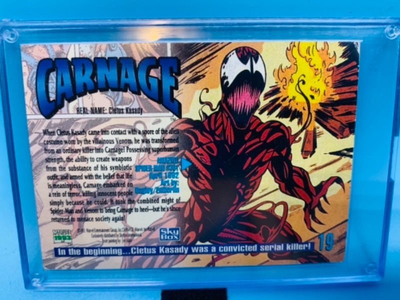 Photo 2 of 767255…1993 Marvel masterpieces carnage card 19 in hard plastic case- skybox 