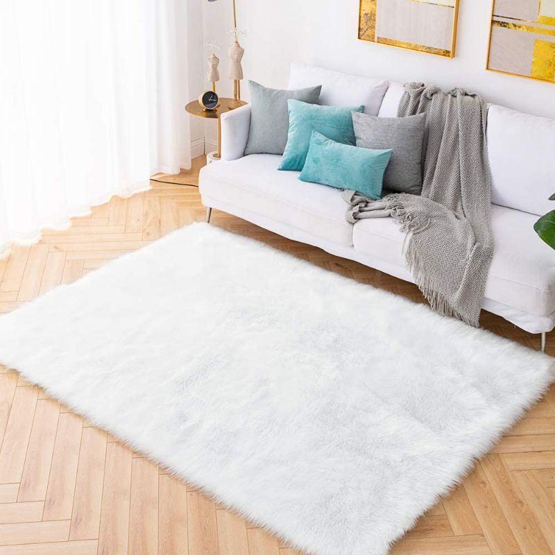 Photo 1 of Carvapet Shaggy Soft Faux Sheepskin Fur Area Rugs Floor Mat Luxury Beside Carpet for Bedroom Living Room 6ft x 9ft, White
