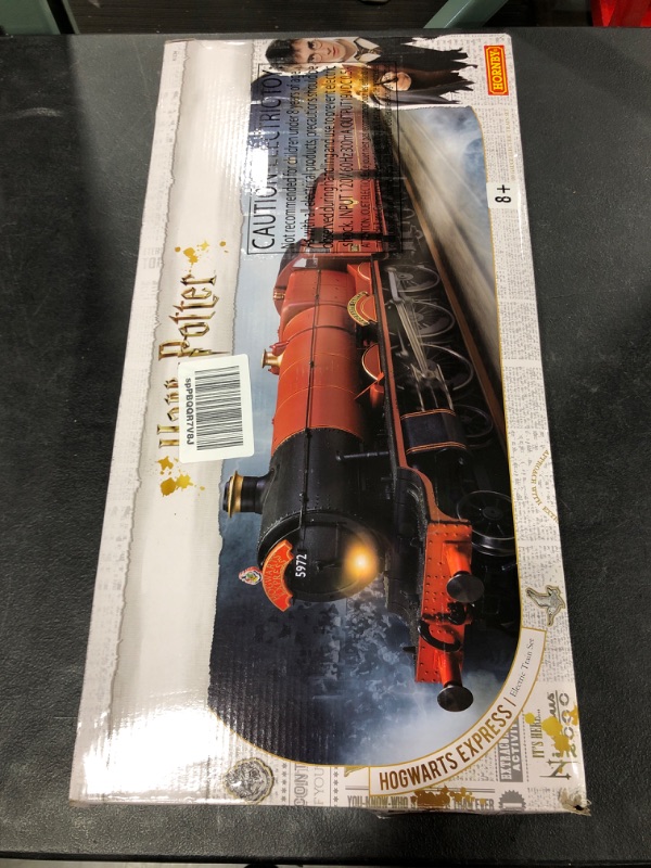 Photo 2 of Hornby Hobbies Warner Brother's Harry Potter Hogwarts Express Electric Model Train Set HO Track with US Power Supply R1234M, Red & Black
