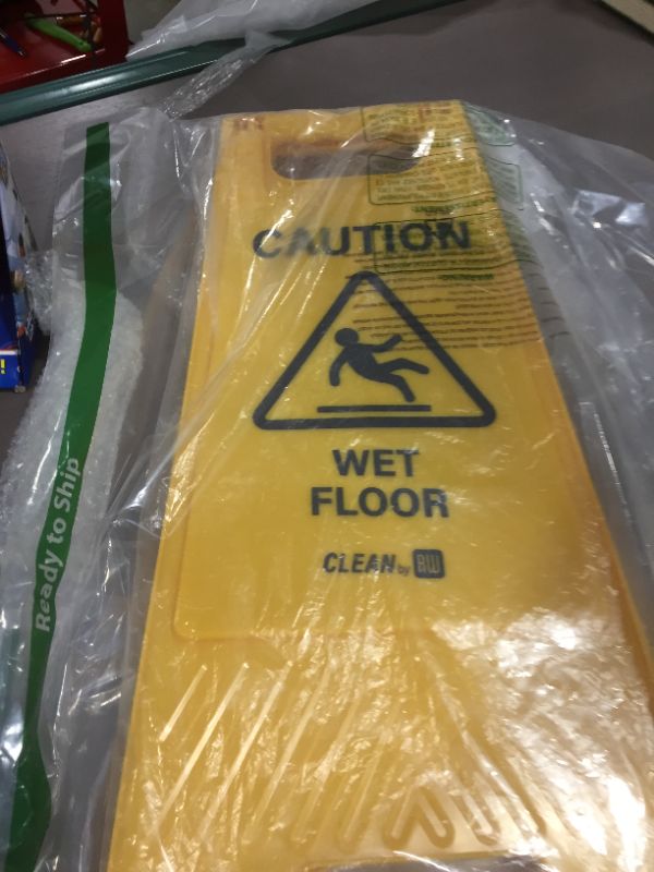 Photo 1 of CAUTION Wet Floor Yellow Sign