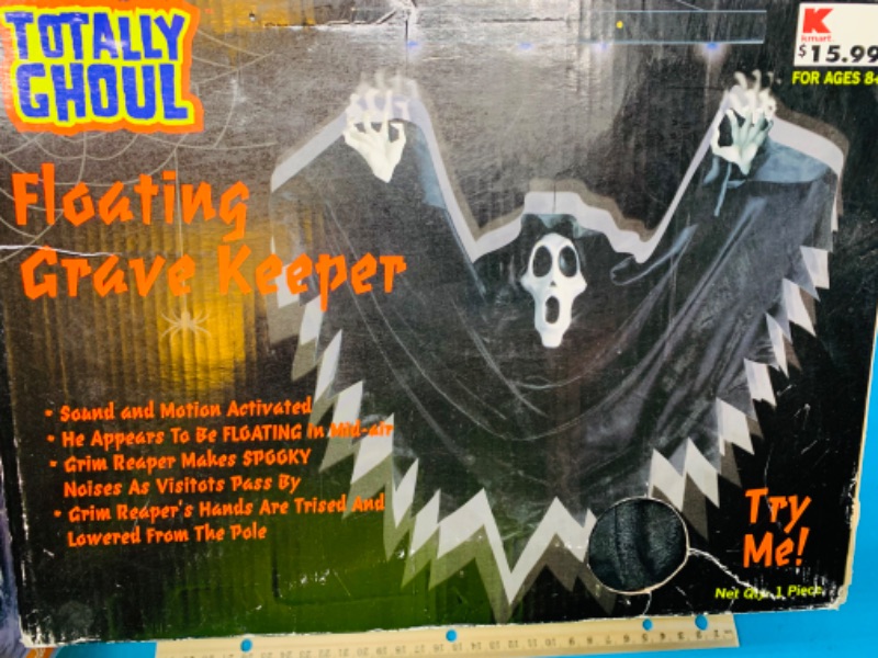 Photo 2 of 777243…2 Halloween items-skull digger and floating grave keeper-  worn boxes