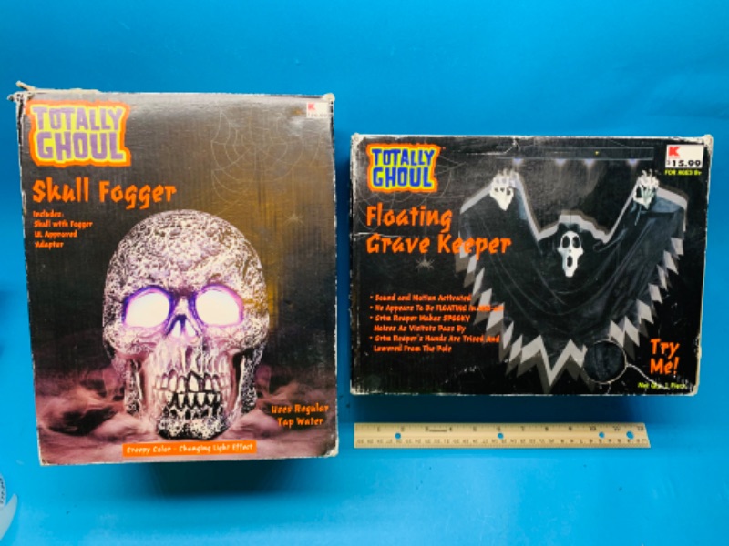 Photo 1 of 777243…2 Halloween items-skull digger and floating grave keeper-  worn boxes