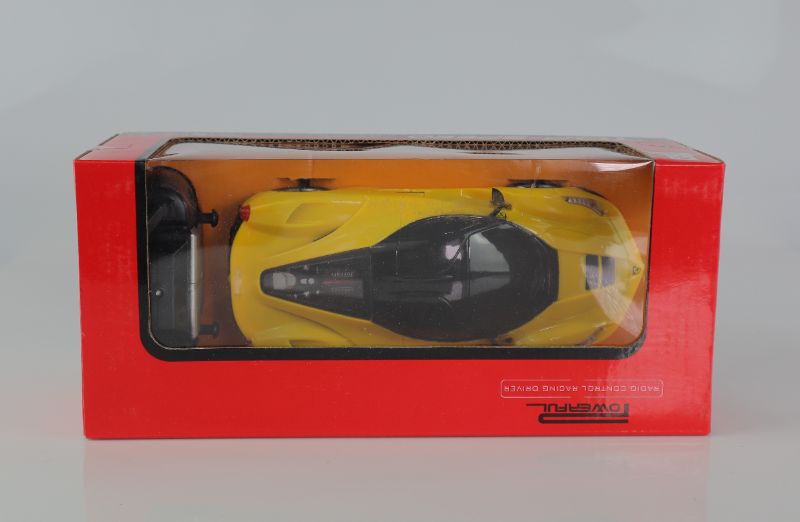 Photo 2 of TOP SPEED RC TOY CAR FAUX FERRARI VEHICLE BUTTERFLY DOORS OPEN REMOTE OPERATED SPEED 10KM//H COLOR YELLOW 5 AA BATTERIES NOT INCLUDED NEW $45