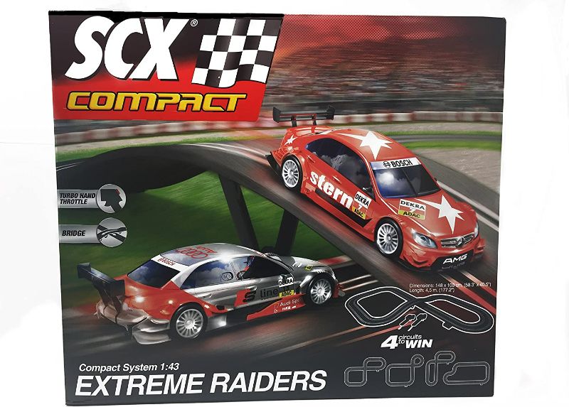 Photo 1 of SCX Extreme Raiders 1:43 Scale Slot Car Set With AC Adaptor and 2 Cars