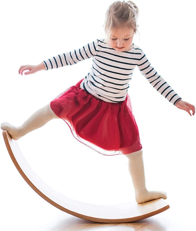 Photo 1 of Gentle Monster Wooden Wobble Balance Board, 35 Inch Rocker Board Natural Wood, Kids Toddler Open Ended Learning Toy , Yoga Curvy Board for Classroom & Office Adult