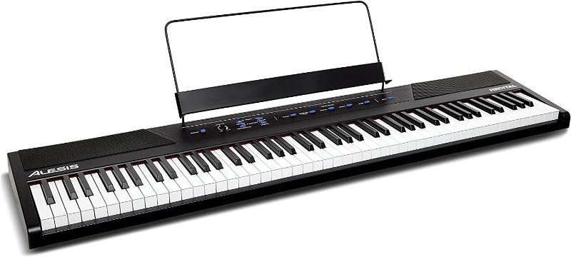 Photo 1 of Alesis Recital – 88 Key Digital Piano Keyboard with Semi Weighted Keys, 2x20W Speakers, 5 Voices, Split, Layer and Lesson Mode, FX and Piano Lessons