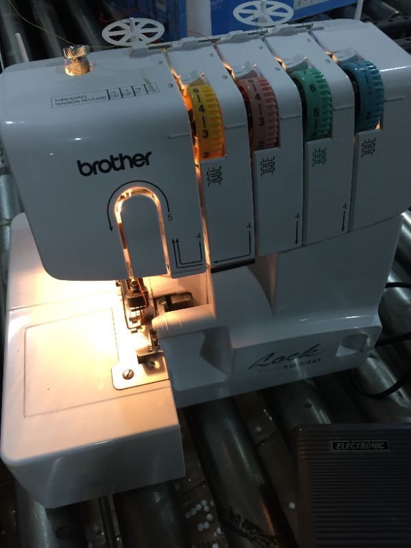 Photo 3 of Brother Serger, 1034D, Heavy-Duty Metal Frame Overlock Machine, 1,300 Stitches Per Minute, Removeable Trim Trap, 3 Included Accessory Feet,White
