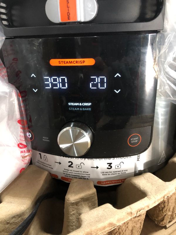 Photo 1 of Ninja OL701 Foodi SMART XL 8 Qt. Pressure Cooker Steam Fryer with SmartLid & Thermometer + Auto-Steam Release, 14-in-1 that Air Fries, Bakes & More, 3-Layer Capacity, 5 Qt. Crisp Basket, Silver/Black
