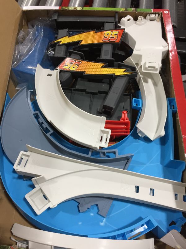 Photo 4 of Disney Pixar Cars Rust-Eze Double Circuit Speedway Playset Test Track Set For Drift, Race and Crash Competitions, With Lightning McQueen Vehicle, Kids Birthday Gift For Ages 4 Years and Older
