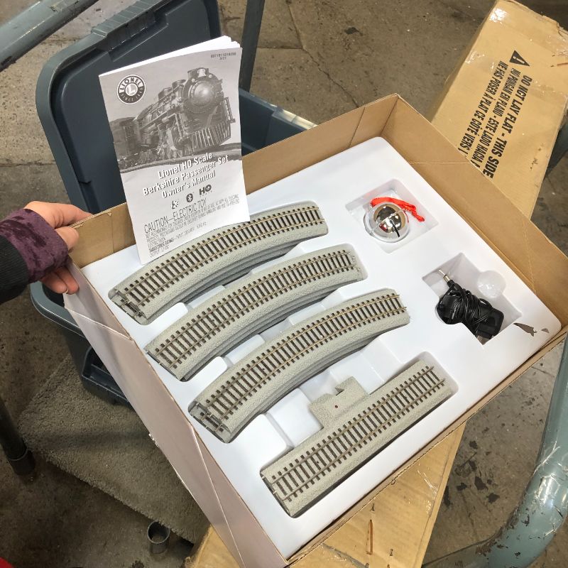 Photo 1 of Lionel The Polar Express Electric HO Gauge, Model Train Set with Remote and Bluetooth + 4-Piece Straight Track Expansion
