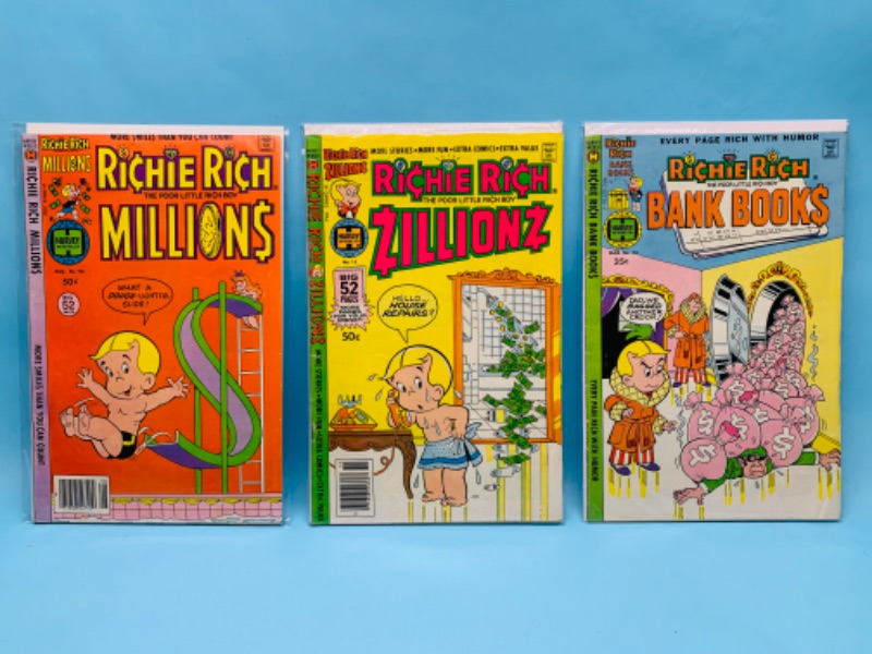 Photo 1 of 802567… three vintage Richie Rich comics in plastic sleeves