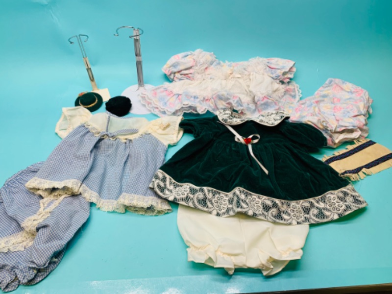 Photo 1 of 802607…vintage baby doll clothing and stands 