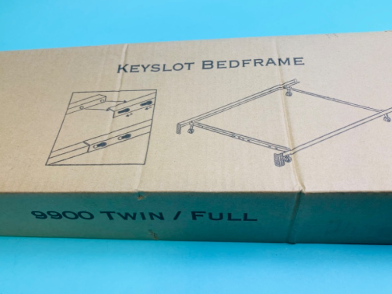 Photo 1 of 802608…twin/ full metal bed frame with four legs and casters in box 