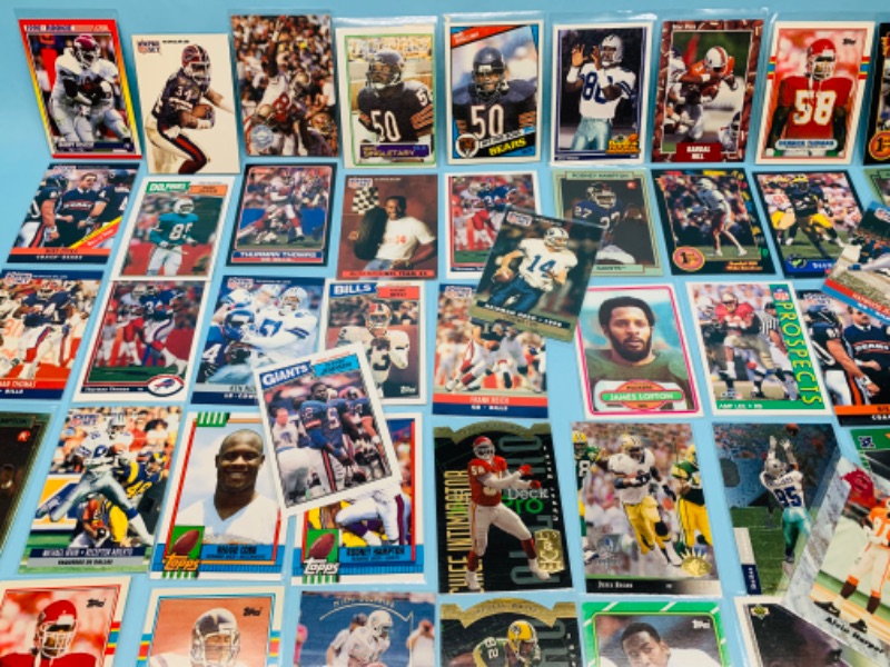 Photo 6 of 802706…70 misc football cards in plastic sleeves 