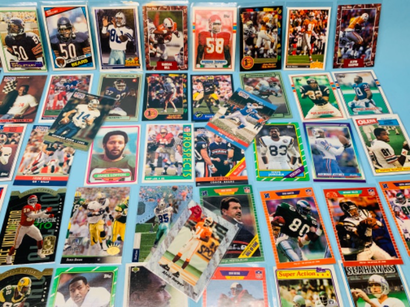 Photo 5 of 802706…70 misc football cards in plastic sleeves 