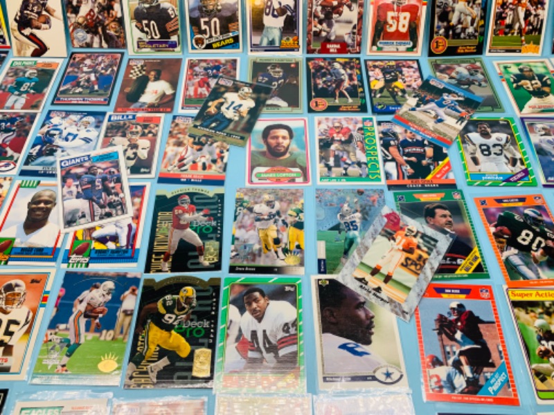 Photo 3 of 802706…70 misc football cards in plastic sleeves 