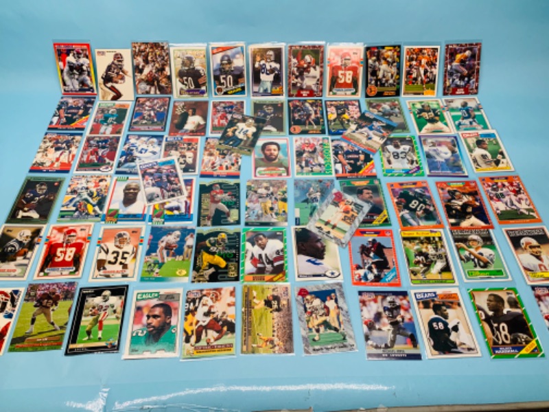 Photo 1 of 802706…70 misc football cards in plastic sleeves 