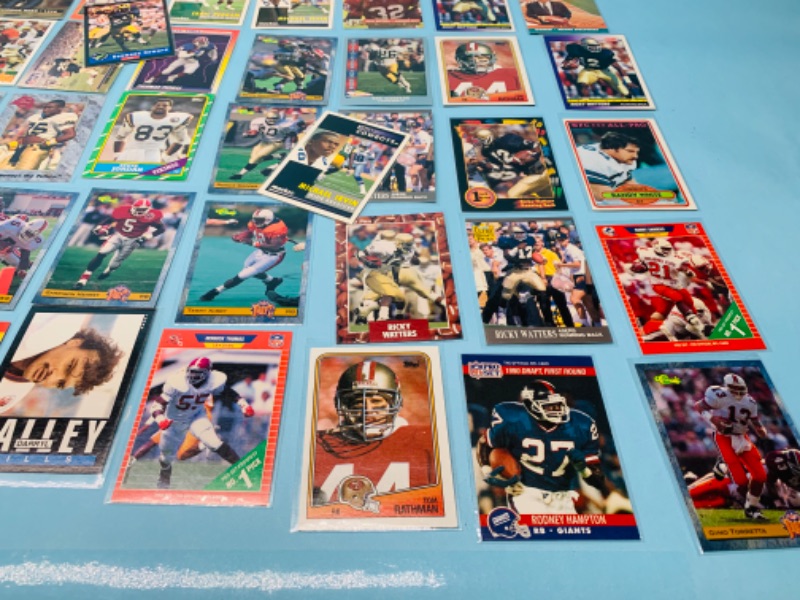 Photo 2 of 802707…60 misc football cards in plastic sleeves 