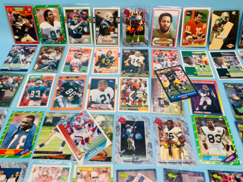 Photo 4 of 802707…60 misc football cards in plastic sleeves 