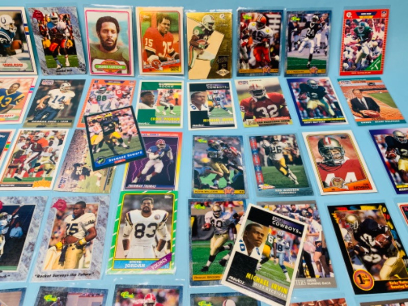 Photo 3 of 802707…60 misc football cards in plastic sleeves 