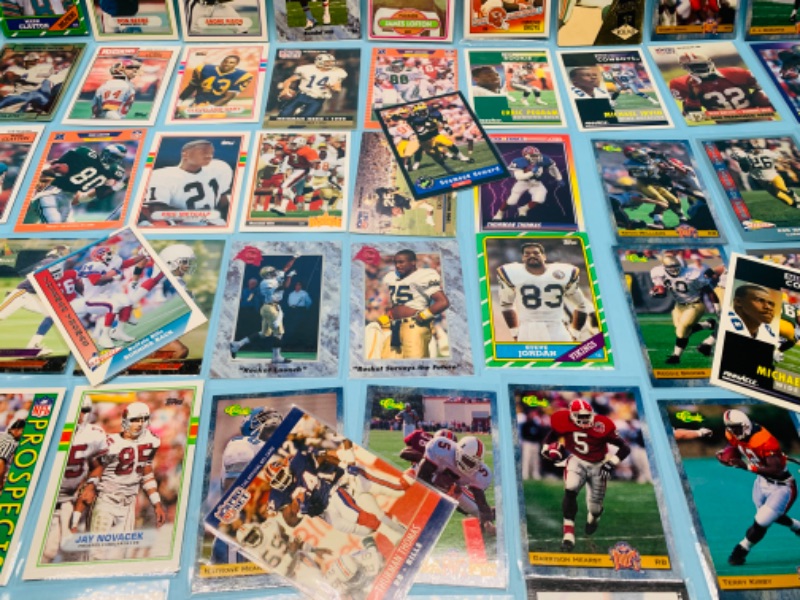 Photo 5 of 802707…60 misc football cards in plastic sleeves 