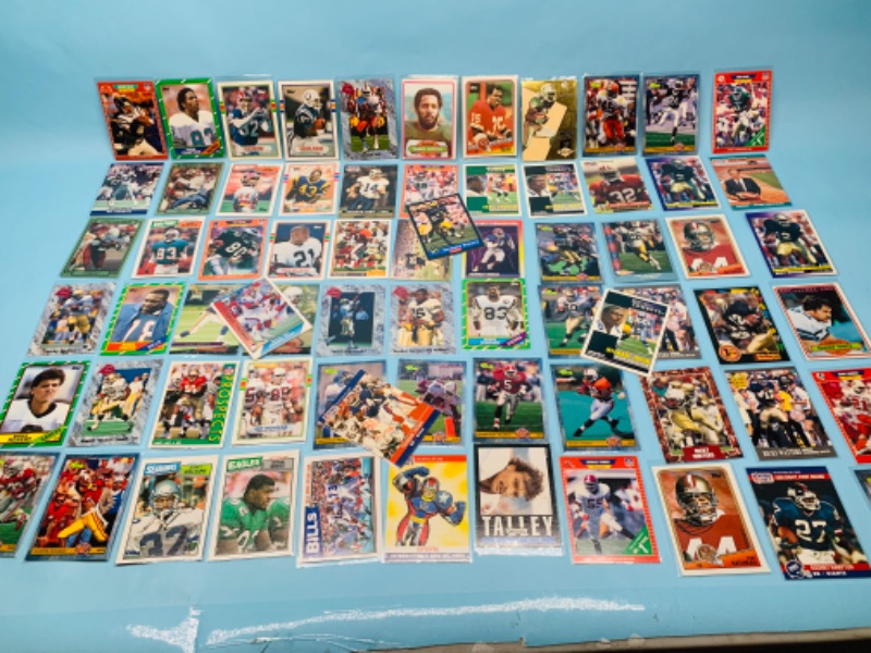 Photo 1 of 802707…60 misc football cards in plastic sleeves 