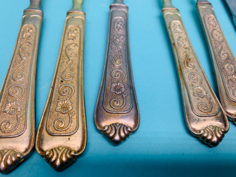 Photo 2 of 802766….old tarnished gold colored silverware 