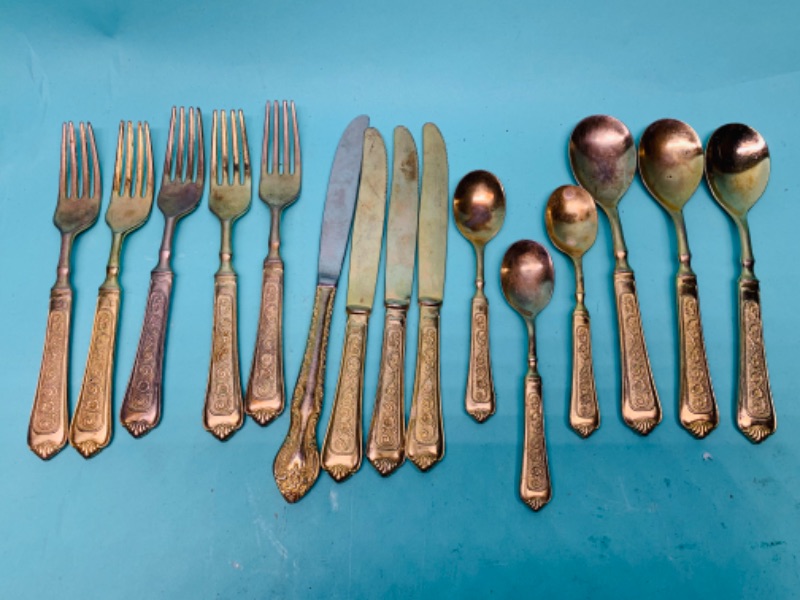 Photo 1 of 802766….old tarnished gold colored silverware 