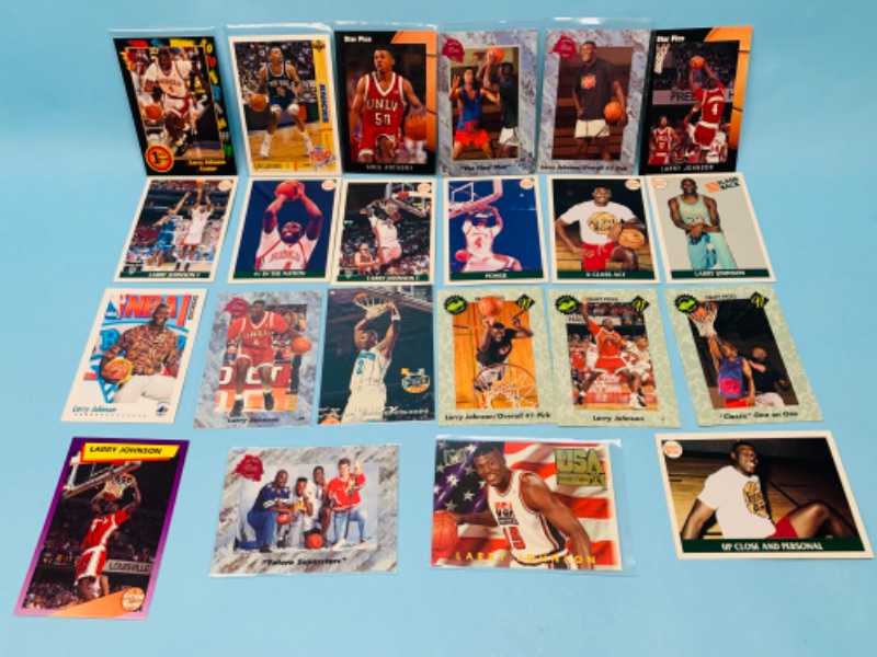 Photo 1 of 802796…23 Larry Johnson trading cards -most in plastic sleeves 