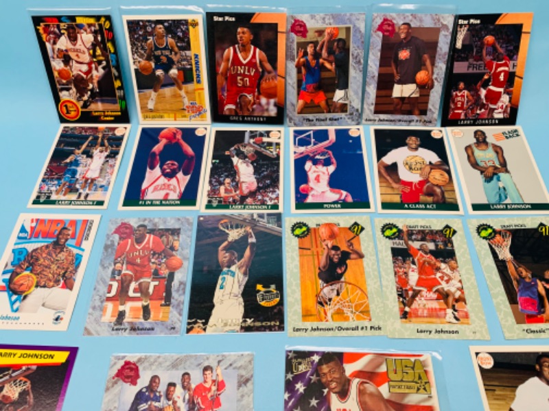 Photo 2 of 802796…23 Larry Johnson trading cards -most in plastic sleeves 